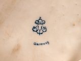 a close up of a plate with a flower on it