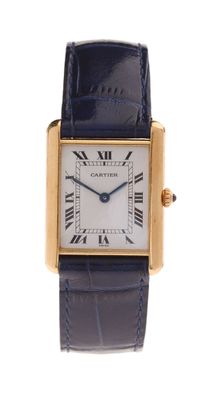 a close up of a wrist watch with roman numerals on it