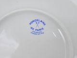 an image of a white plate with a blue logo on it