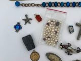 a close up of a bunch of jewelry on a white surface