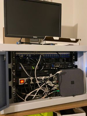an image of a computer cabinet with a monitor on top of it