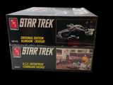 two boxes of star trek toys on a black background