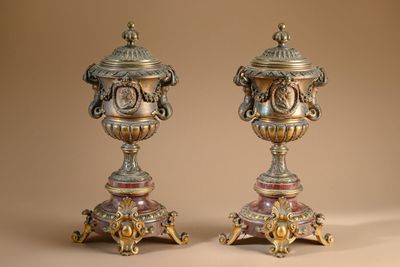 two vases sitting on top of each other on a table
