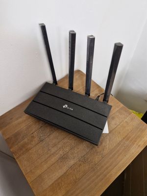 a wooden table with a bunch of knives on top of it