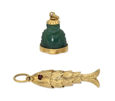 two pieces of gold and green glass with a fish on it