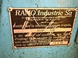 an old machine with a sign on it ' s side