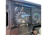 a close up of a dashboard with a speedometer and gauges