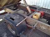 a truck with a trailer attached to the back of it