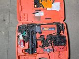 an orange tool case with tools in it on the ground