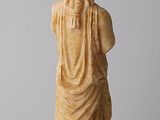 an image of a statue of a woman holding a bowl on top of her head