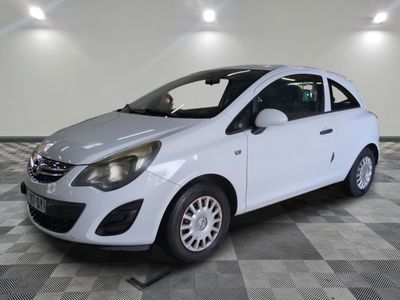 a picture of a small white car parked in a garage