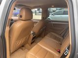beige leather seats in the back of a car in a parking lot