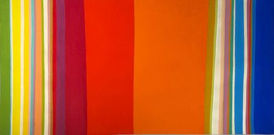 an image of a room with a couch and a colorful striped wall