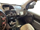 a dashboard of a car with a steering wheel and dashboard controls