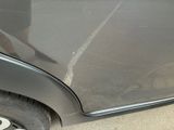 a close up of a car ' s front door with the door handle missing
