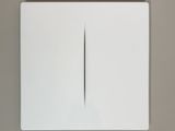 an overhead view of a white light switch on a gray wall