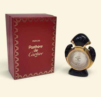 an image of a black and gold clock next to a red box