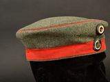 an image of a military hat with a red band