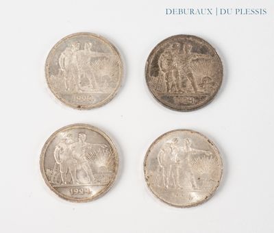 four different types of coins are shown on a white surface