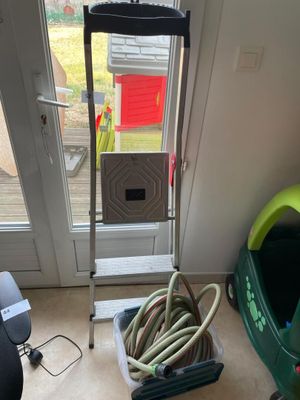 an image of a room with a ladder and hoses