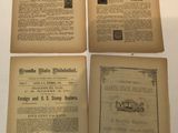 four pages of old newspaper sit on top of a white table