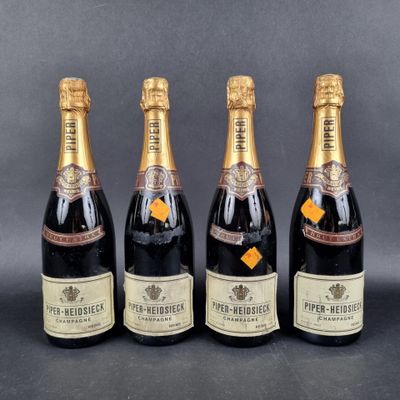 three bottles of champagne sitting next to each other on a table