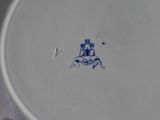 a white plate with a blue design on it