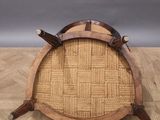 an image of a wooden chair with a wicker seat on top of a wooden floor