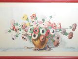 a painting of flowers in a vase on the wall
