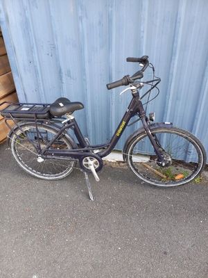 a bike that is parked in front of a building