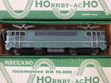 a green box with a train on it and a box with a train on it
