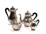 three pieces of silver tea and coffee set on a white background