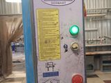 a machine that has a green light on it