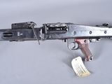 a close up of a gun with a tag attached to it