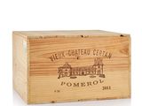 a close up of a wooden box with a wine label on it