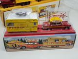 three toy vehicles that are sitting on top of each other