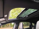 a view of the sunroof from inside of a car