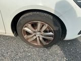 a white car that has a flat tire on it
