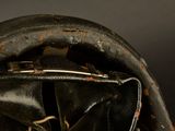 a close up of a baseball glove with a ball inside of it
