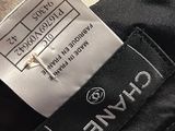 the label on a black jacket is showing the name of the brand