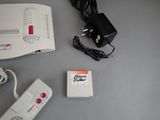 a nintendo game console and a game controller on a table