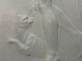 a statue of a woman and a dog on a pedestal