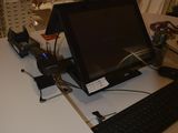 a laptop computer sitting on top of a white desk