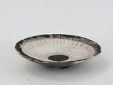 black and white bowl on a white surface
