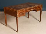 a small wooden table with a drawer on top of it