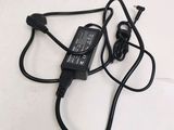 an image of a charger that is plugged into a laptop
