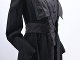 a black dress on a mannequin mannequin with a white background
