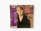 an image of a cd with a picture of a woman in a black dress