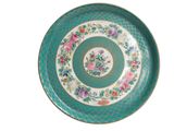 a green plate with flowers on it on a white background