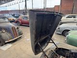 many old cars that are parked in a garage